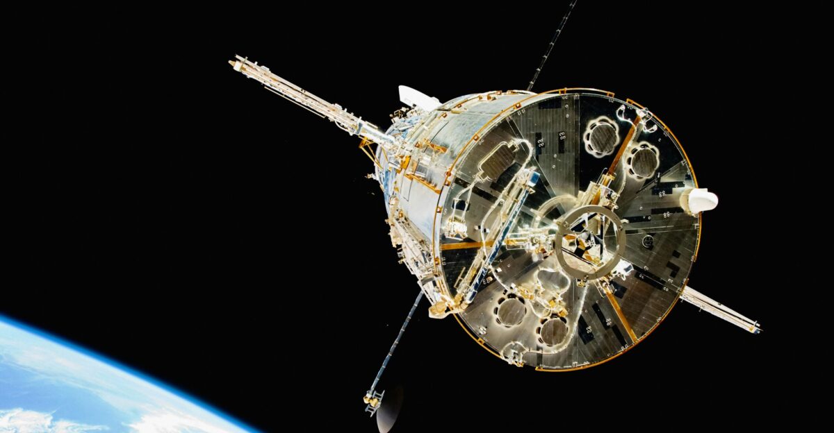 a satellite in orbit with the earth in the background