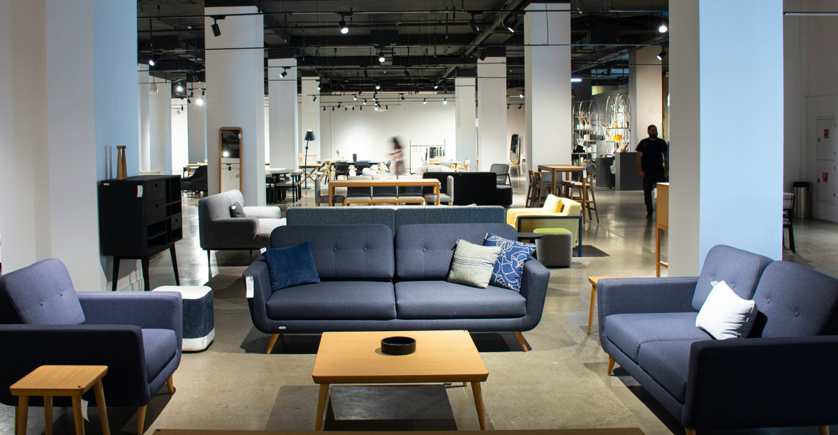 A large room with couches, tables and chairs