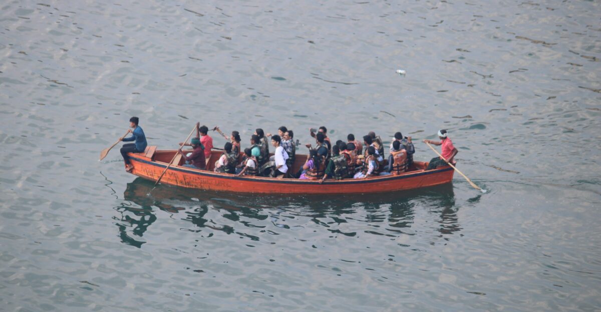 People are riding in a boat on the water