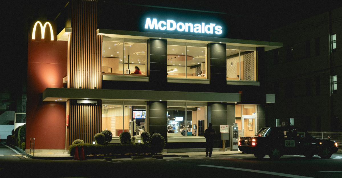 A mcdonald's restaurant illuminated at night.