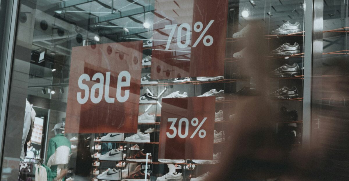 A storefront announces a sale of 70 and 30 off
