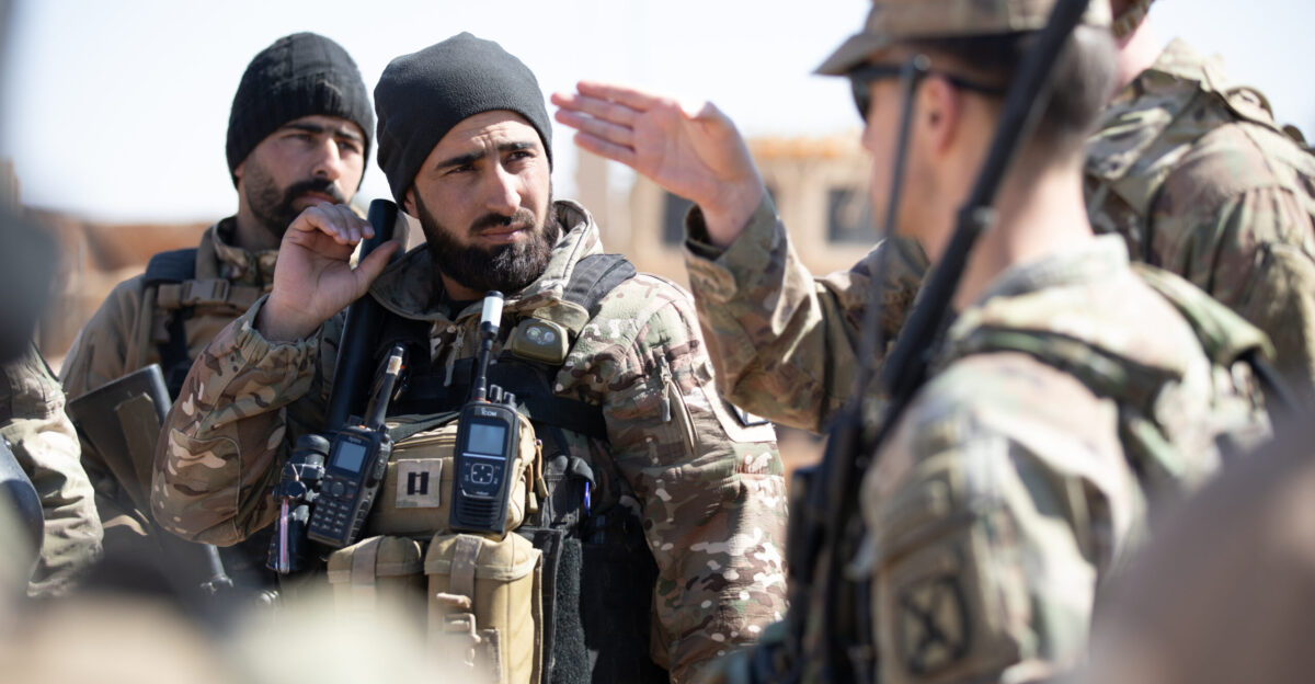 A Syrian partner force officer listens to a pre-training brief as he joins U S Army Soldiers assigned to the 10th Mountain Division Task Force Armadillo for air assault training at Al-Tanf Garrison Syria on Feb 25 2025 The training reflects the Coalition s ongoing efforts to enhance the capabilities of partner forces and strengthen partnerships The Coalition is committed to advising assisting and enabling partner forces to defeat ISIS and maintain regional security and stability U S Army photo by Staff Sgt Fred Brown