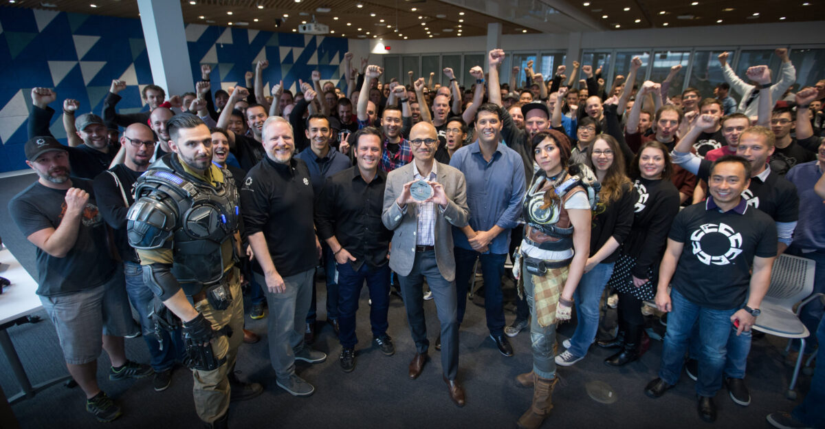 Satya Nadella CEO of Microsoft holds the gold master disc of Gears of War 4 at The Coalition game development studio in 2016