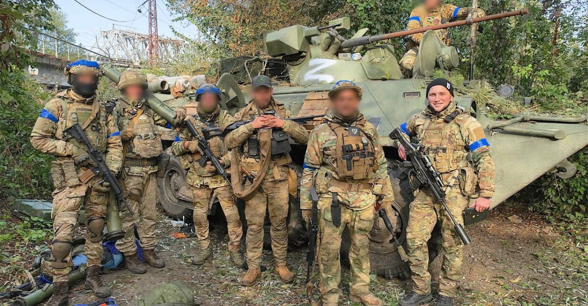 Soldiers of Kraken special unit in front of the captured russian BMP-1AM Basurmanin after the liberation of Kupisansk-Vuzlovyi October 2022