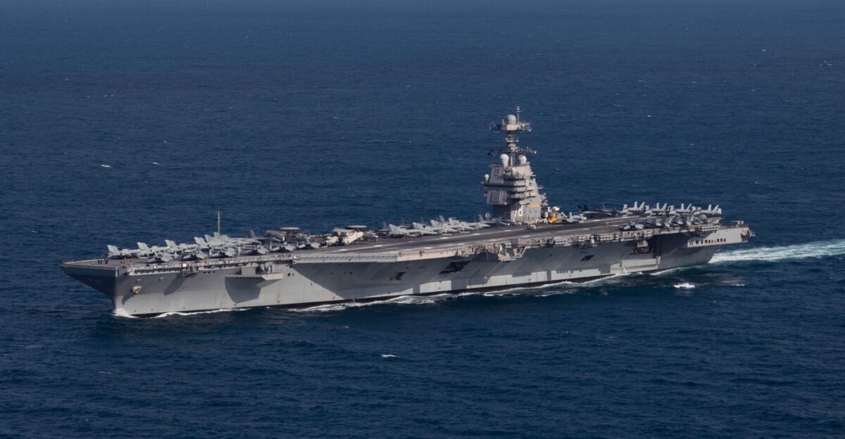 The U S Navy aircraft carrier USS Gerald R Ford CVN-78 steams the Atlantic Ocean during a simulated straits transit with the Gerald R Ford Carrier Strike Group GRFCSG in the Atlantic Ocean 9 October 2022 The Gerald R Ford Carrier Strike Group was deployed in the Atlantic Ocean conducting training and operations alongside NATO allies and partners since 5 October 2022 On deck are aircraft of Carrier Air Wing 8 CVW-8